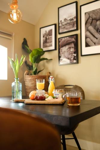 a table with a tray of food on it at Landgoed Lodges Scholten Linde in Rossum