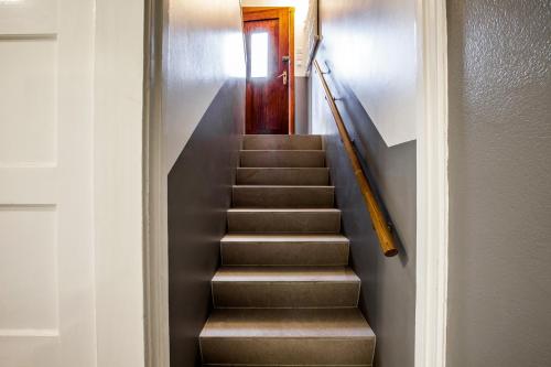 a stairway with brown steps and a stair case at Apartments Reykjavik in Reykjavík