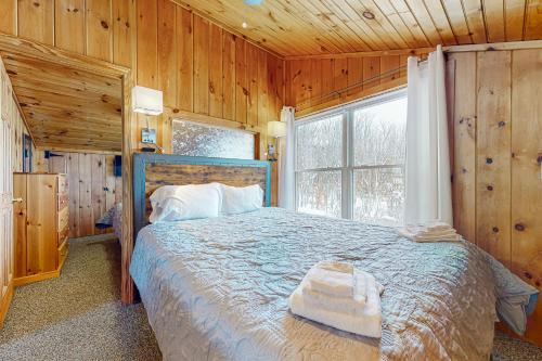 Ένα ή περισσότερα κρεβάτια σε δωμάτιο στο Garage Cottage