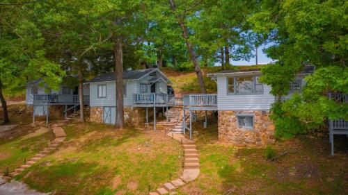 an aerial view of a house in the woods at Lakeshore Fishing cabin 1 , dock/boat slip, fire pit. in Lake Ozark