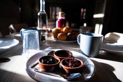a plate of food on top of a table at Gite Auberge Les Cascades in La Mongie