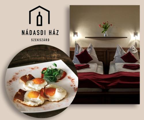 a plate of food on a table in a hotel room at Nádasdi Ház in Szekszárd