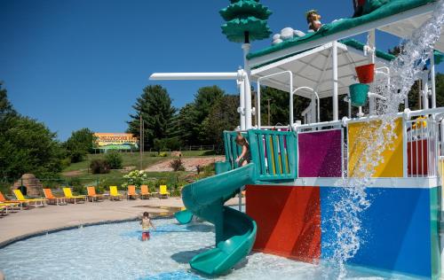a water park with a slide in the water at Yogi Bear's Jellystone Park Camp-Resort Wisconsin Dells in Wisconsin Dells