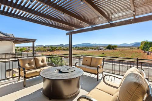 a patio with a table and chairs on a balcony at Ocotillo Springs Resort 45 l Brand New Property, Private Pool, Hot Tub, & Community Pool in Santa Clara
