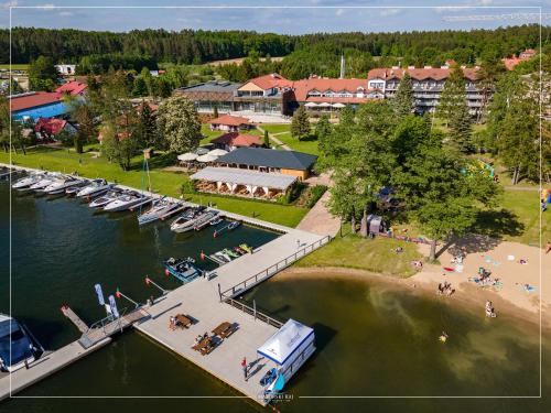 an aerial view of a marina with boats in the water at Mazurski Raj - Hotel, Marina & Spa in Ruciane-Nida