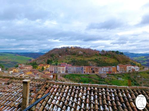 a town on top of a hill with houses at Casa Vacanze Donna Erminia in Calitri