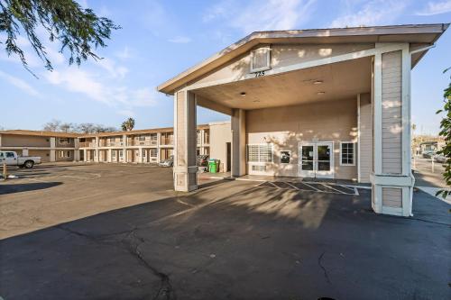 an empty parking lot in front of a building at Heritage Inn Express Chico in Chico