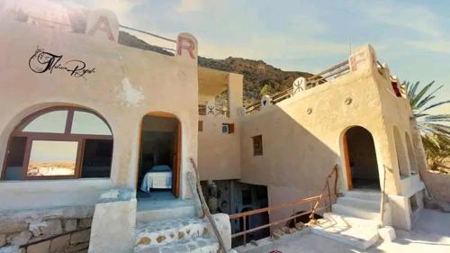 a house with a staircase leading up to it at Dar Fatma Toujane in Tūjān