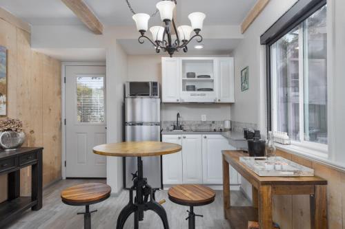 a kitchen with a table and some stools in it at Sky Ranch Lodge in Sedona