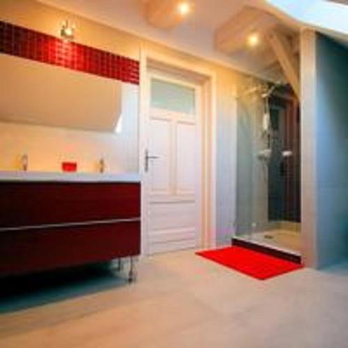 a bathroom with a sink and a glass shower at Świetnokrzyska Chata in Bodzentyn