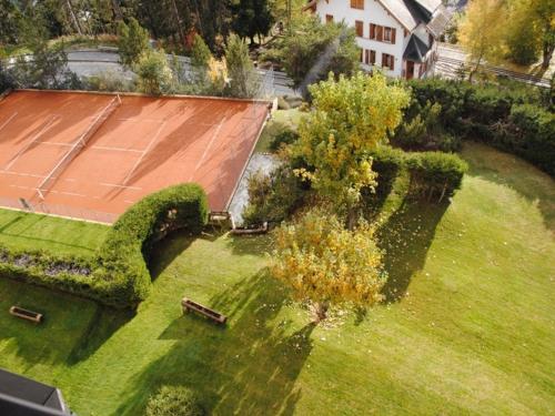 an aerial view of a yard with a house at Residence Cransalpin in Crans-Montana