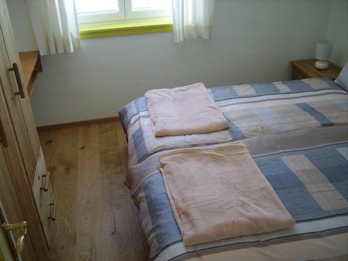 a bedroom with two beds with pillows on them at Alpencottage Bad Aussee in Bad Aussee