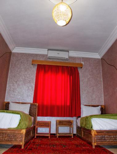Cama o camas de una habitación en Appartement Afgo Ouarzazate