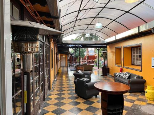 a lobby with couches and a table in a building at Hostería Residencial Santa Rosa in Los Andes