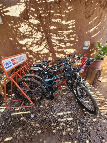 a group of bikes parked next to a wall at Masairi in San Pedro de Atacama