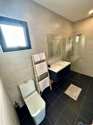 a bathroom with a toilet and a sink at Blossom Villa - Lamai, Koh Samui - Entire Villa in Ban Thung
