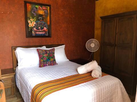 Tempat tidur dalam kamar di Casa El Conquistador