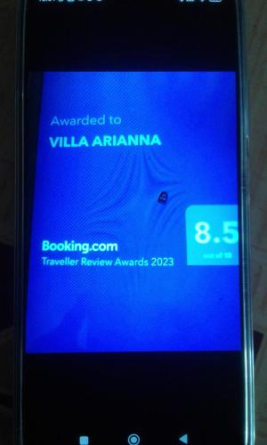 a close up of a cell phone with a blue screen at VILLA ARIANNA in Wattala