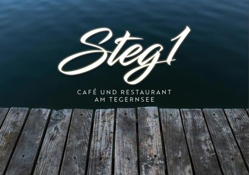 a view of the water from a wooden pier at Seehotel zur Post in Tegernsee