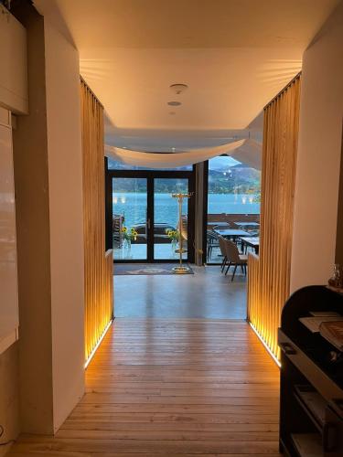 a hallway with a view of the ocean from a house at Seehotel zur Post in Tegernsee