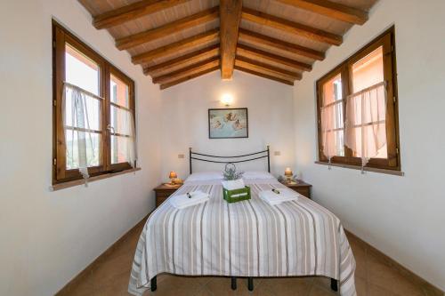 Ένα ή περισσότερα κρεβάτια σε δωμάτιο στο Il Giogo Agriturismo