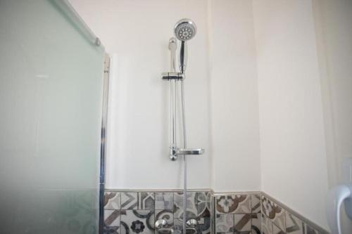 a shower stall in a bathroom with a shower at Villa Rebecca in Porto Cesareo