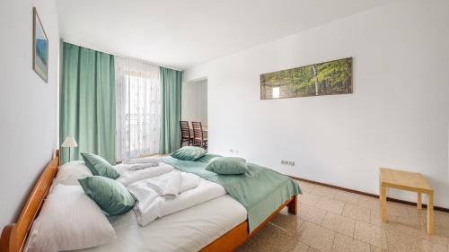 Posteľ alebo postele v izbe v ubytovaní Apartamenty Sun & Snow Marea