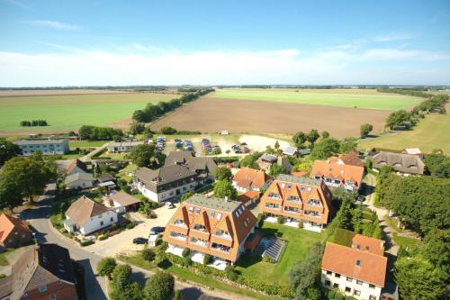 an aerial view of a village with houses and a field at hafennahe Ferienwohnung mit Balkon und Meerblick - Hafenhäuser Breege FeWo 11 in Breege