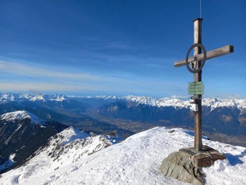 a cross on top of a snow covered mountain at Apartments FEICHTNER Manfred -Tulfes - Innsbruck-Land - Tirol in Tulfes