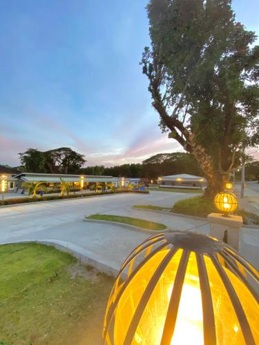 a yellow umbrella sitting on the side of a street at Aurora Villas and Cabin Resort in Clark