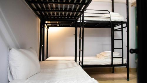 a room with two bunk beds and a bed at Language Exchange Hotel 3 in Ho Chi Minh City