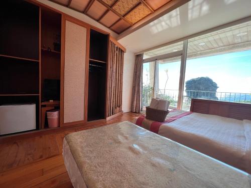 Postel nebo postele na pokoji v ubytování Ming Jun Homestay