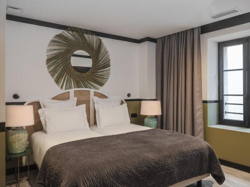 Letto o letti in una camera di Maisons du Monde Hôtel & Suites - Marseille Vieux Port