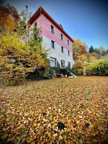 a pile of leaves in front of a building at HARABURDI® Recyclart Hotel in Kostelec nad Orlicí