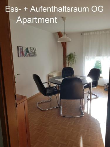 a dining room with a table and chairs at Ferien Mecklenburgische Seenplatte, Urlaub auf dem Gutshof Bossow in Bossow