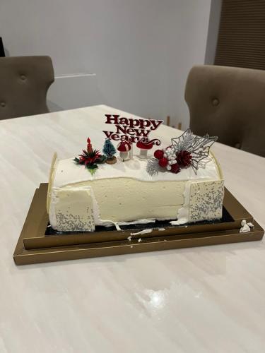 a birthday cake sitting on top of a table at TJ Homes - One double bed room with garden view - Next to tube station in Ruislip