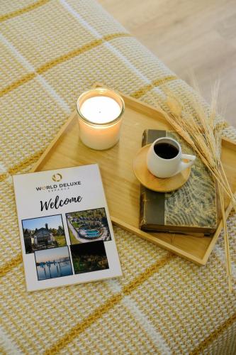 a table with a book and a cup of coffee at World DREAMS Sapanca in Sakarya