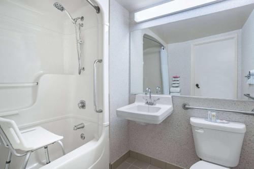 a bathroom with a sink and a toilet and a shower at Travelodge by Wyndham Bridgewater in Bridgewater
