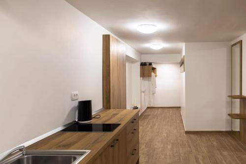 a kitchen with a sink and a counter top at Vila Marin in Prevalje