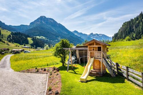 a playground in the mountains with a slide at Appartement Angerhaus in Kleinarl