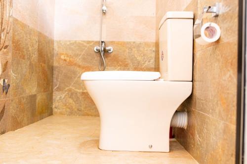 a bathroom with a toilet in a room at Shan Star Weligama in Weligama