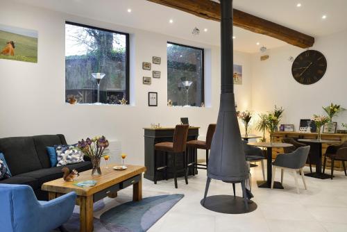 a living room with a wood stove in it at La Rozeliere 