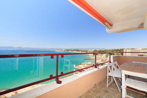 a balcony with a view of the ocean at UHC CANTILMAR in Salou