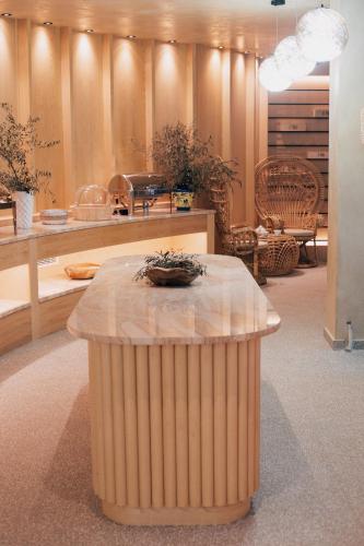 a room with a table with a bowl on top of it at White Hill Hotel, SPA & Conferences in Durrës