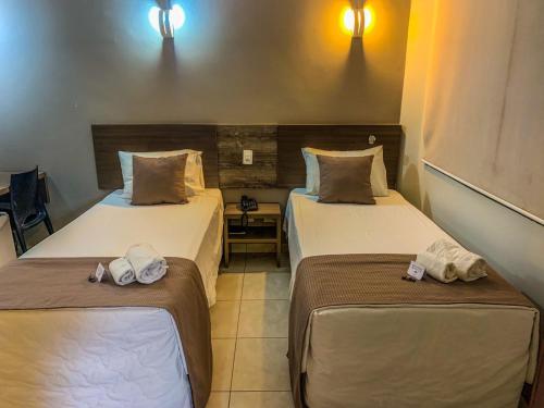 Hotel Piratininga Fernando Corrêa - Rondonópolisにあるベッド