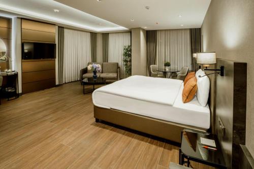 Katil atau katil-katil dalam bilik di Kızılkaya Business Otel