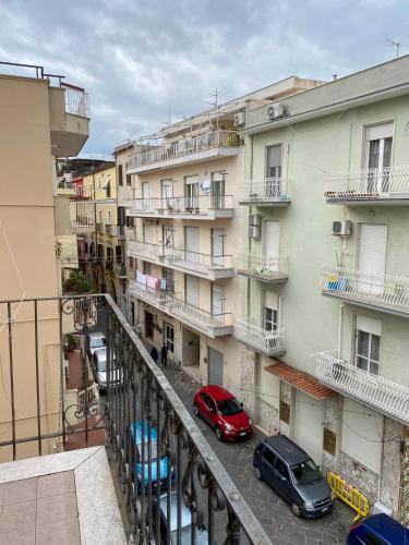 two cars parked on a balcony of a building at Holiday House Ginevra in Formia