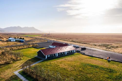 an aerial view of a house in the middle of a field at HOTEL SNAEFELLSNES formally Hotel Rjukandi in Vegamót