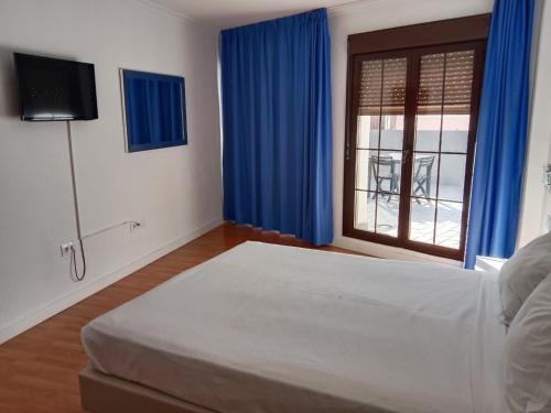 Postel nebo postele na pokoji v ubytování Hotel Trafalgar