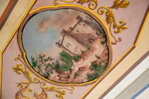 a picture of a painting of a building on a wall at Il Vicolo Relais in Sirolo